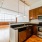 a kitchen with wooden cabinets