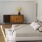 a bedroom with a bed and a fan