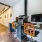 a room with a desk and chairs