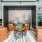a room with a couch and chairs